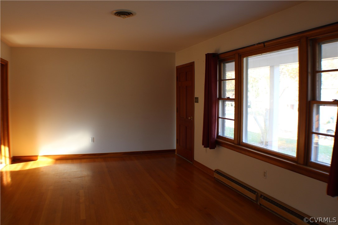8132 Concho Road North Chesterfield, VA 23237 - Photo 5 of 32 an empty room with wooden floor and windows