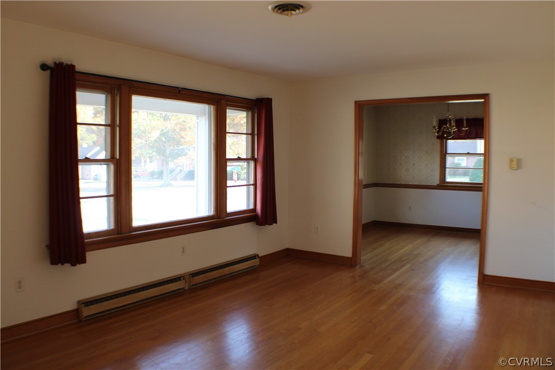 8132 Concho Road North Chesterfield, VA 23237 - Photo 6 of 32 an empty room with wooden floor and windows
