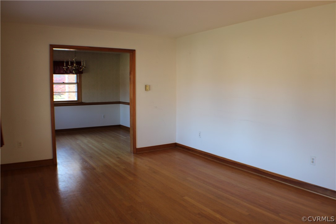 8132 Concho Road North Chesterfield, VA 23237 - Photo 7 of 32 a view of empty room with wooden floor and fan