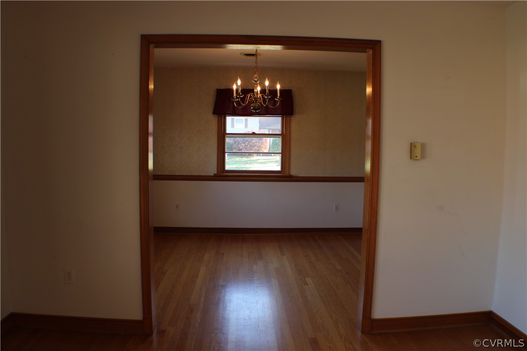 8132 Concho Road North Chesterfield, VA 23237 - Photo 8 of 32 a view of a small space with wooden floor and a window