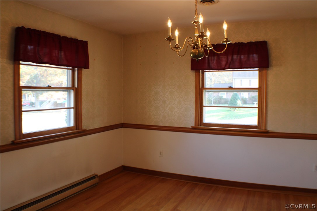 8132 Concho Road North Chesterfield, VA 23237 - Photo 9 of 32 a view of a room with wooden floor and large windows
