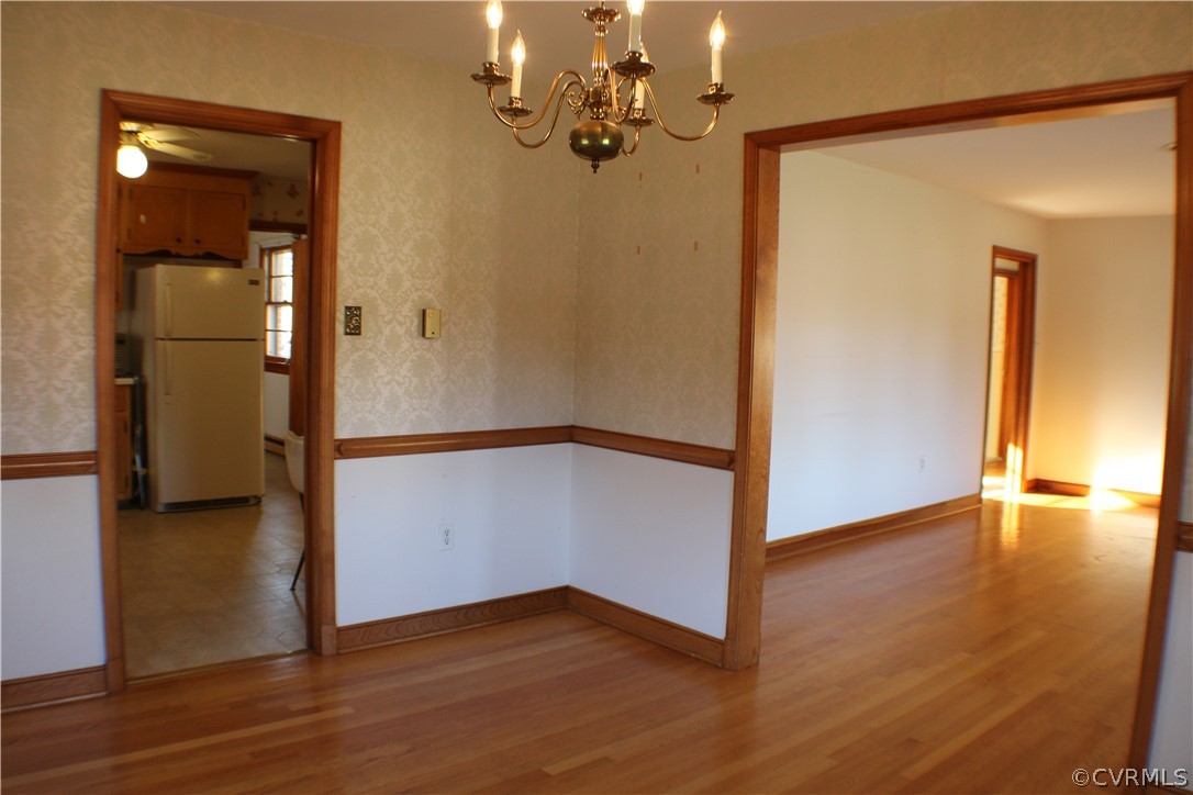 8132 Concho Road North Chesterfield, VA 23237 - Photo 10 of 32 a view of a hallway with wooden floor