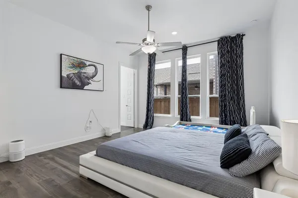 a bathroom with a double vanity sink mirror and shower