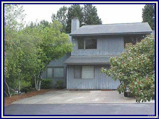 4366 Hunters Club Drive Raleigh, NC 27606 - Photo 1 of 1 a house that has a tree in front of it