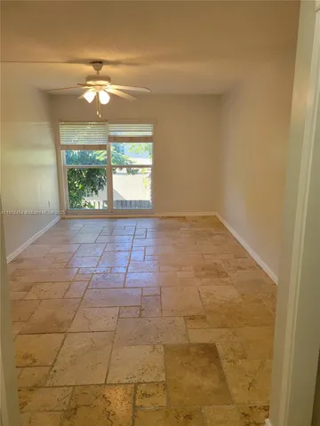 a kitchen with stainless steel appliances granite countertop a sink a stove and a granite counter top