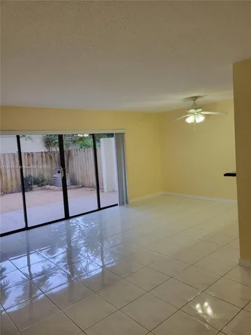 a large bathroom with a large tub and chandelier