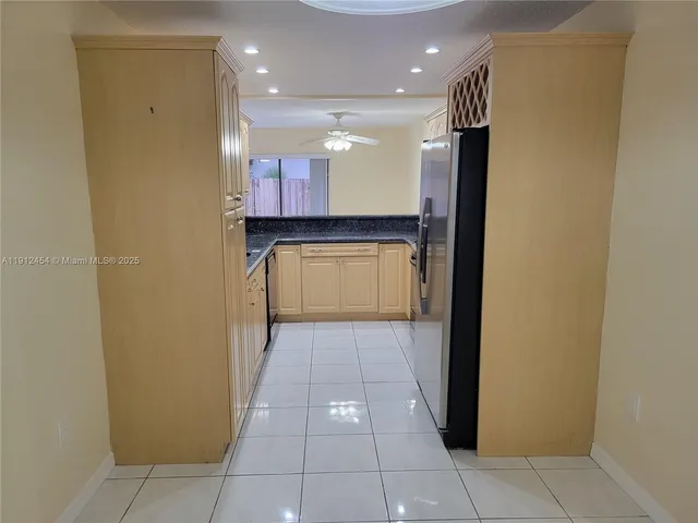 a view of empty room with a fireplace