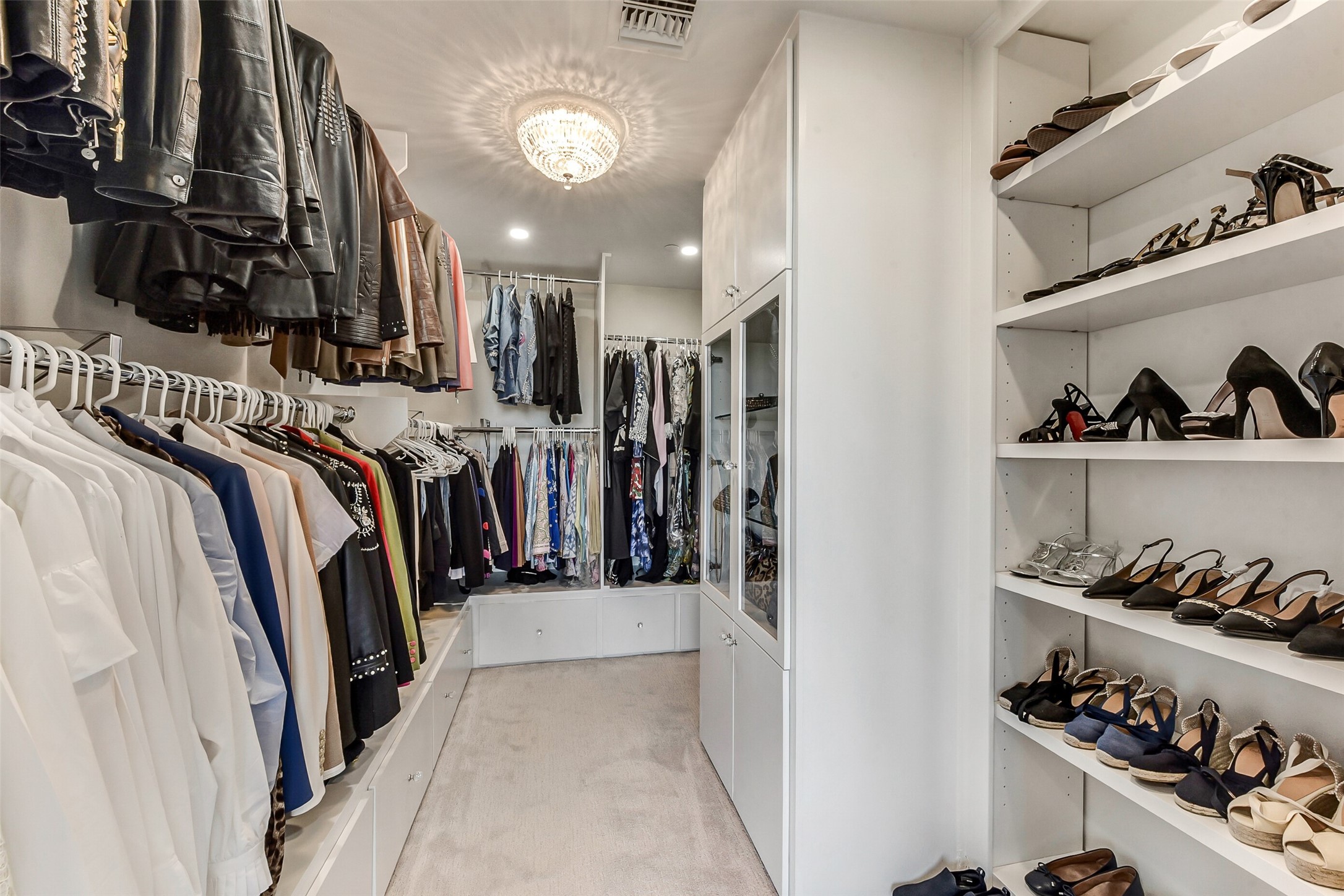 5100 San Felipe Street, Unit 164 Houston, TX 77056 - Photo 20 of 30 a view of walk in closet with clothes and shoes