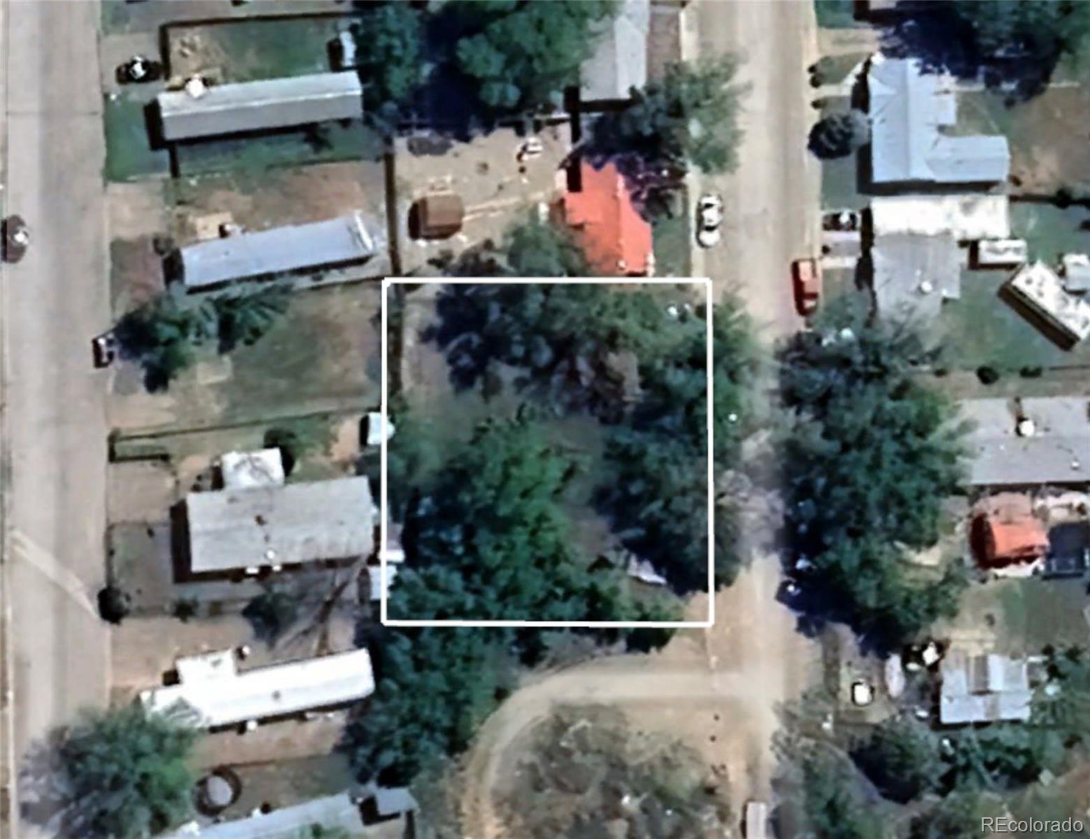 770 Stratton Drive Cortez, CO 81321 - Photo 4 of 6 an aerial view of a house with a yard and large trees