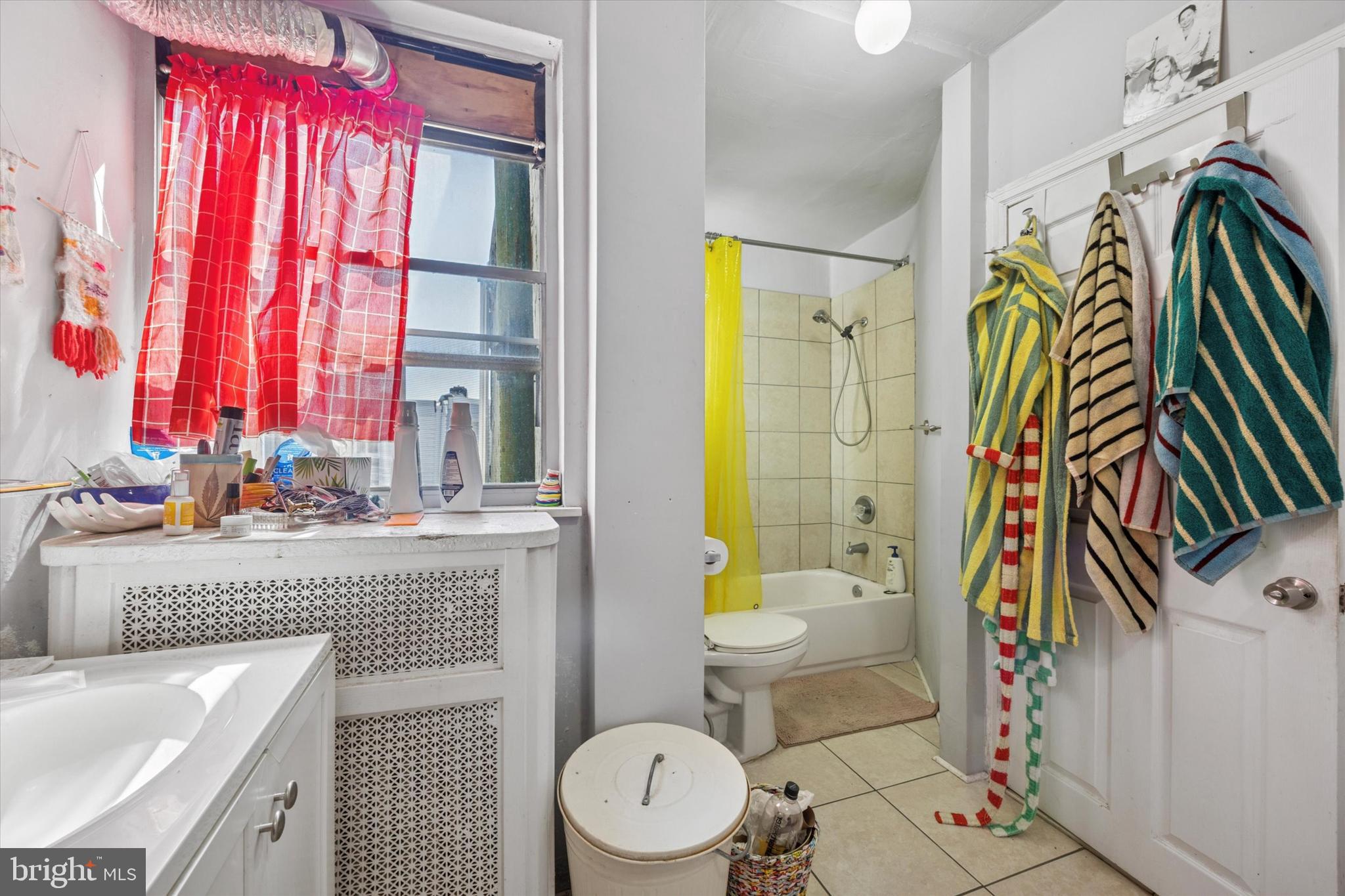 1726 Watkins Street Philadelphia, PA 19145 - Photo 11 of 15 a bathroom with a sink a toilet and shower