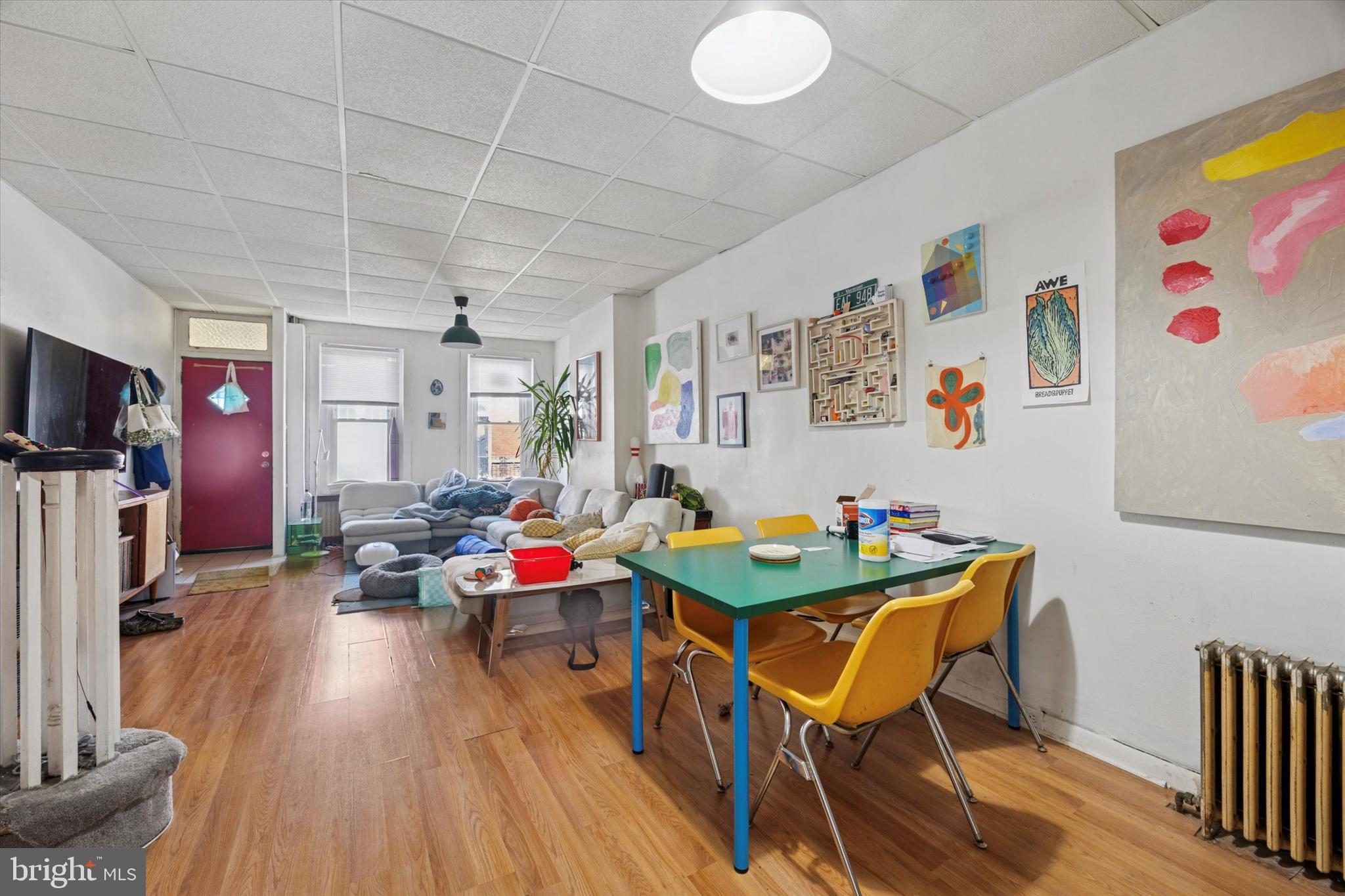 1726 Watkins Street Philadelphia, PA 19145 - Photo 5 of 15 a view of a dining room with furniture and wooden floor