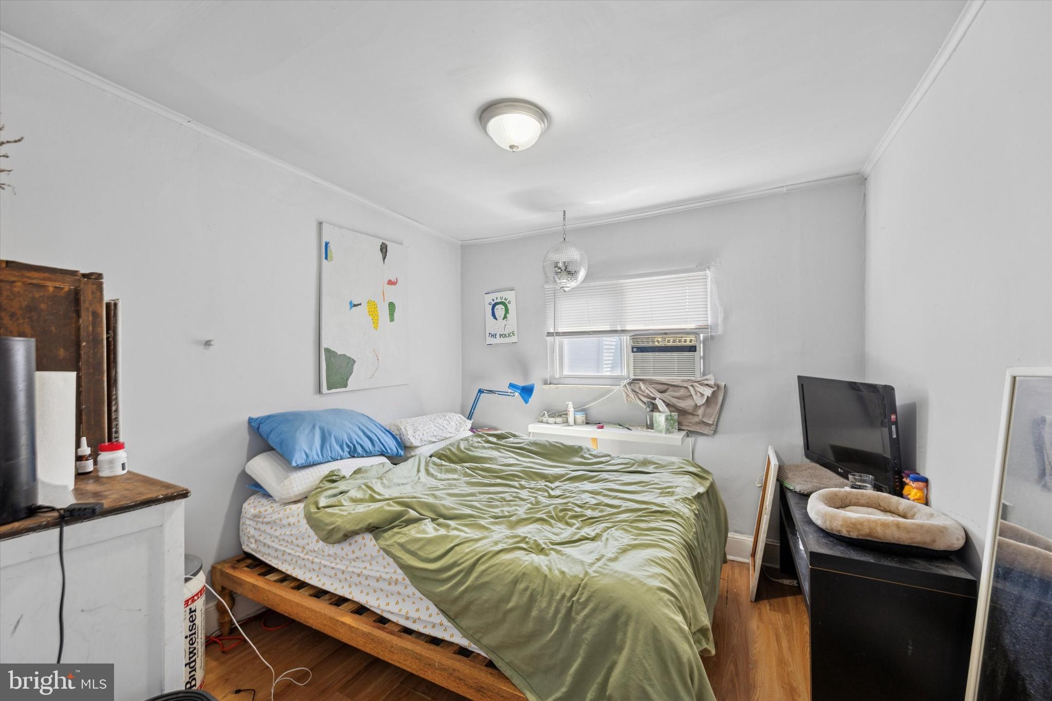 1726 Watkins Street Philadelphia, PA 19145 - Photo 8 of 15 a bedroom with a bed and flat screen tv