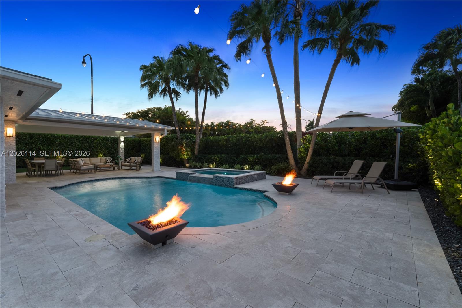 9641 Southwest 66th Street Miami, FL 33173 - Photo 48 of 57 a view of a swimming pool with a patio