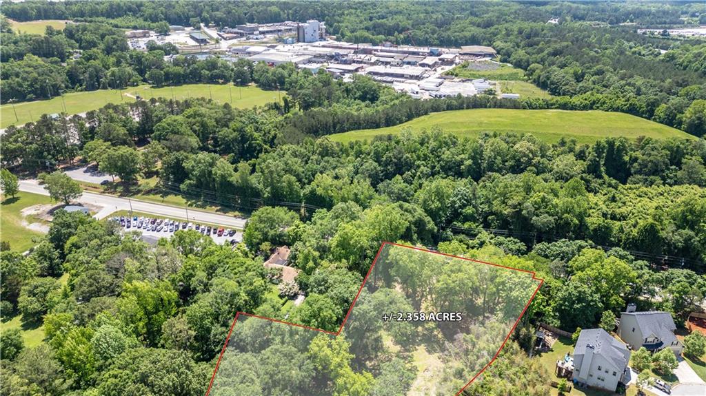5387 Austell Powder Springs Road Southwest Austell, GA 30106 - Photo 11 of 11 a view of a garden with a building