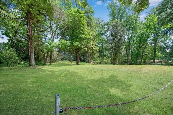a view of outdoor space with deck and trees
