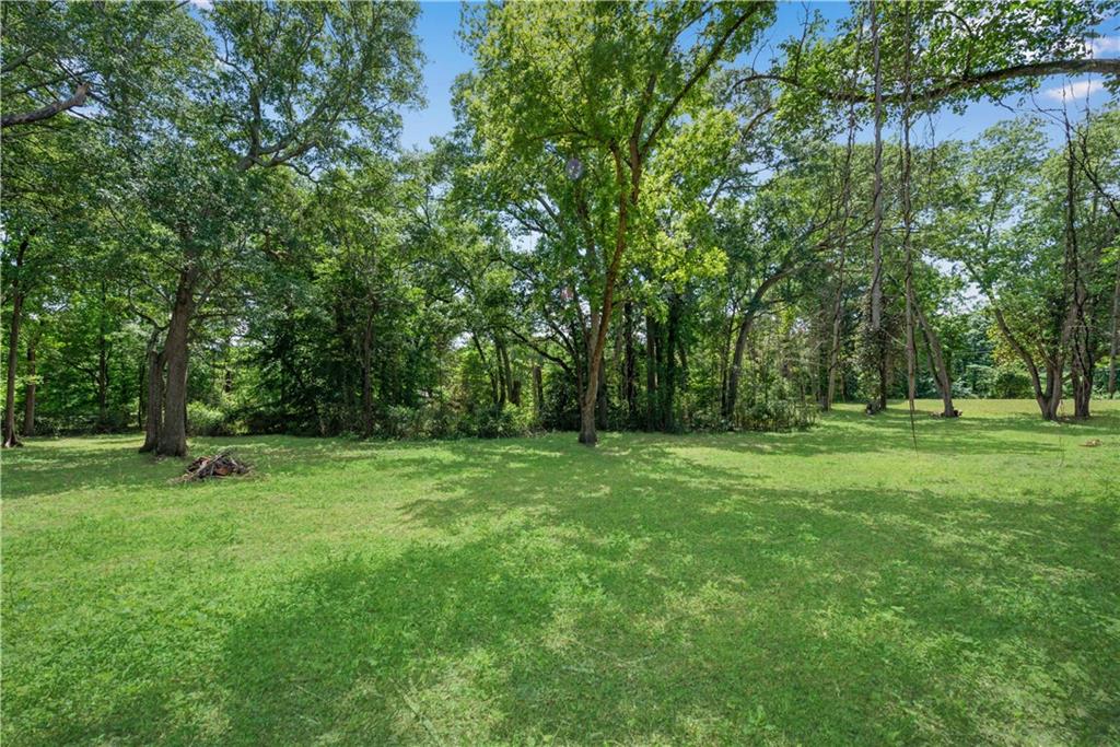 5387 Austell Powder Springs Road Southwest Austell, GA 30106 - Photo 10 of 11 a view of outdoor space with deck and yard