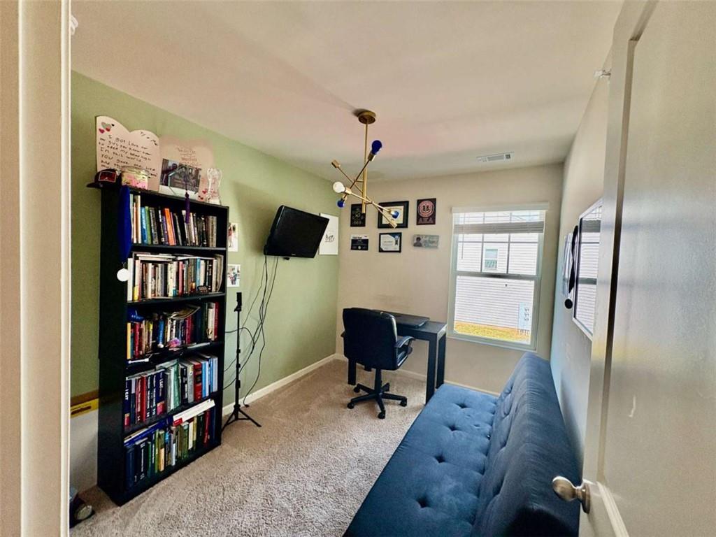 2176 Cypress Lane Southwest Atlanta, GA 30331 - Photo 12 of 17 a workspace with furniture hardwood and a window