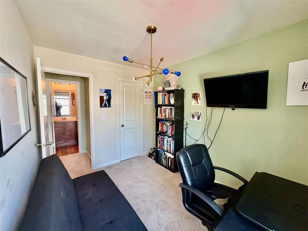 2176 Cypress Lane Southwest Atlanta, GA 30331 - Photo 13 of 17 a room with furniture and a flat screen tv