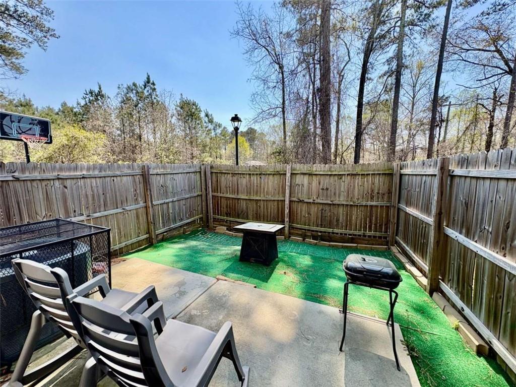 2176 Cypress Lane Southwest Atlanta, GA 30331 - Photo 17 of 17 a view of a chairs and table in the back yard