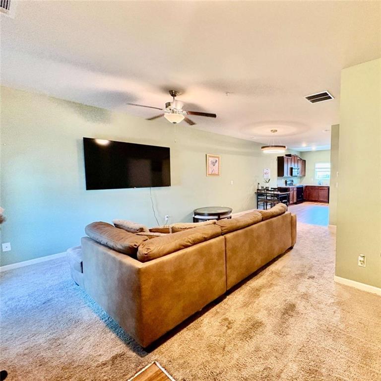 2176 Cypress Lane Southwest Atlanta, GA 30331 - Photo 2 of 17 a living room with furniture and a flat screen tv