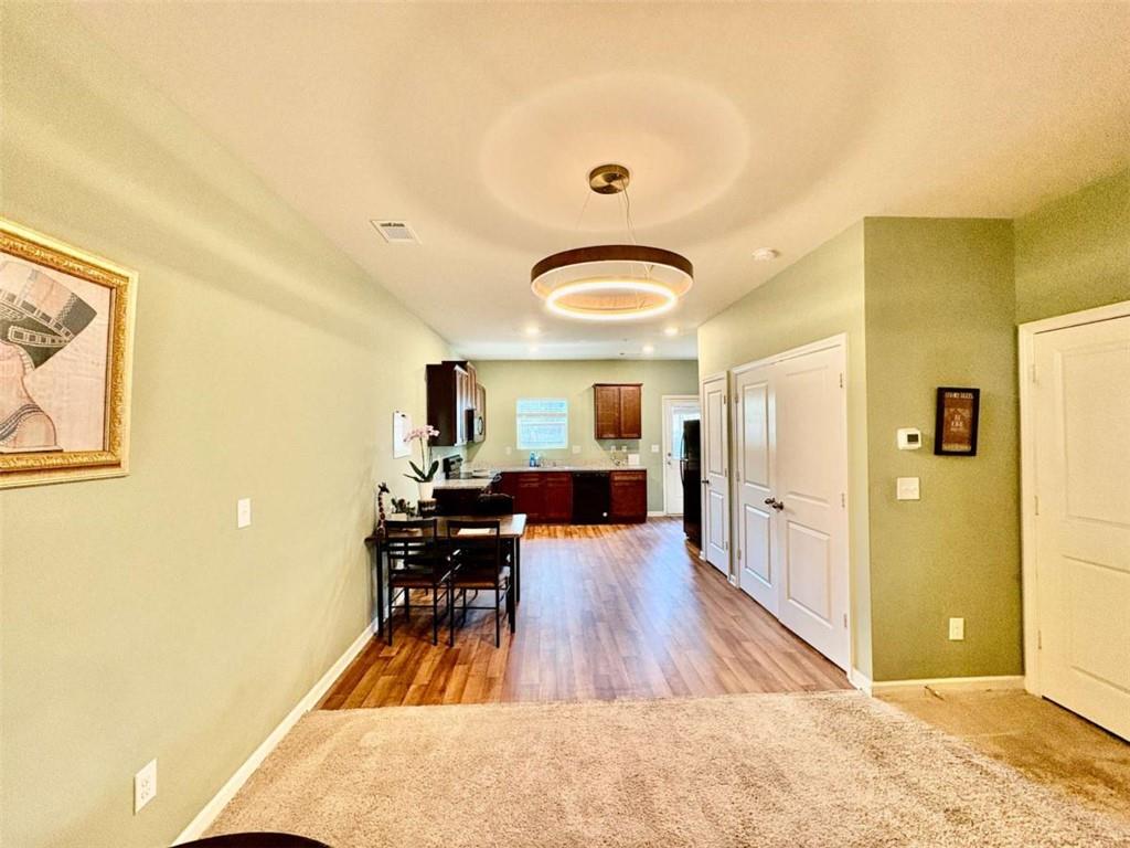 2176 Cypress Lane Southwest Atlanta, GA 30331 - Photo 3 of 17 a view of a dining room with furniture and wooden floor