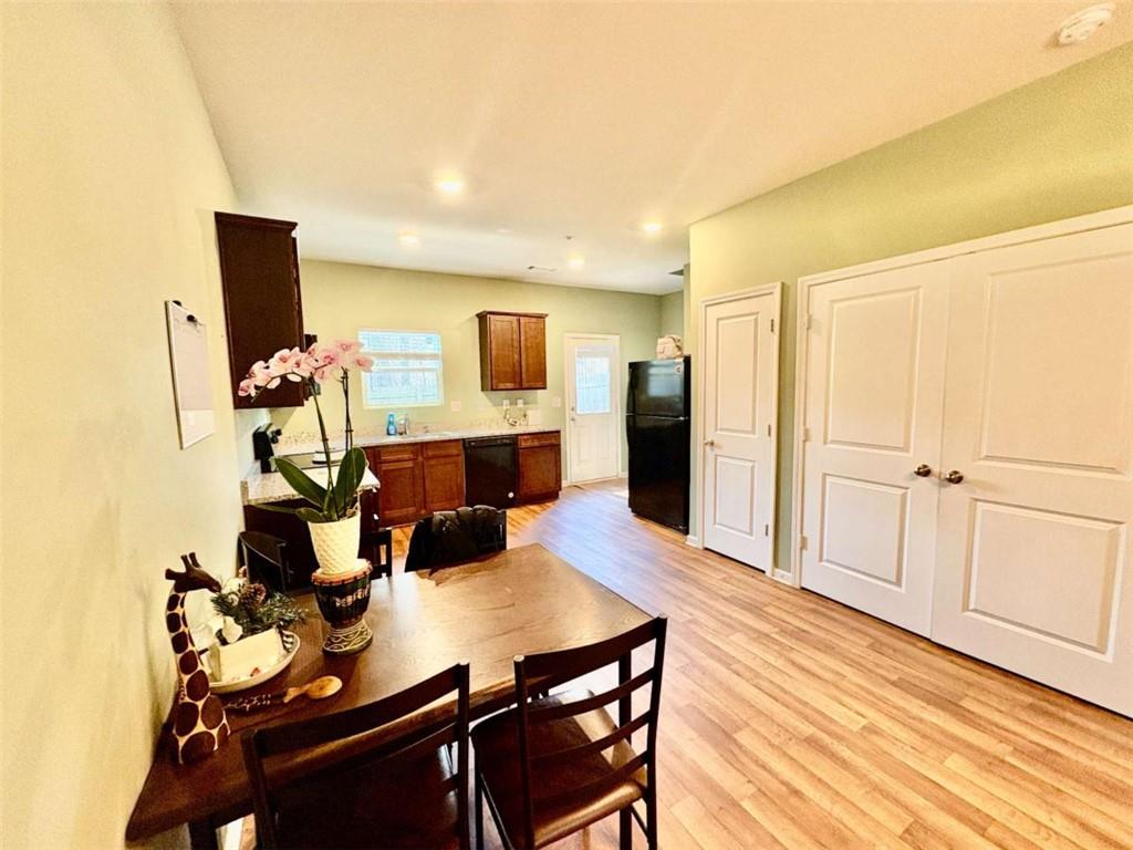 2176 Cypress Lane Southwest Atlanta, GA 30331 - Photo 5 of 17 a view of a dining room with furniture and wooden floor