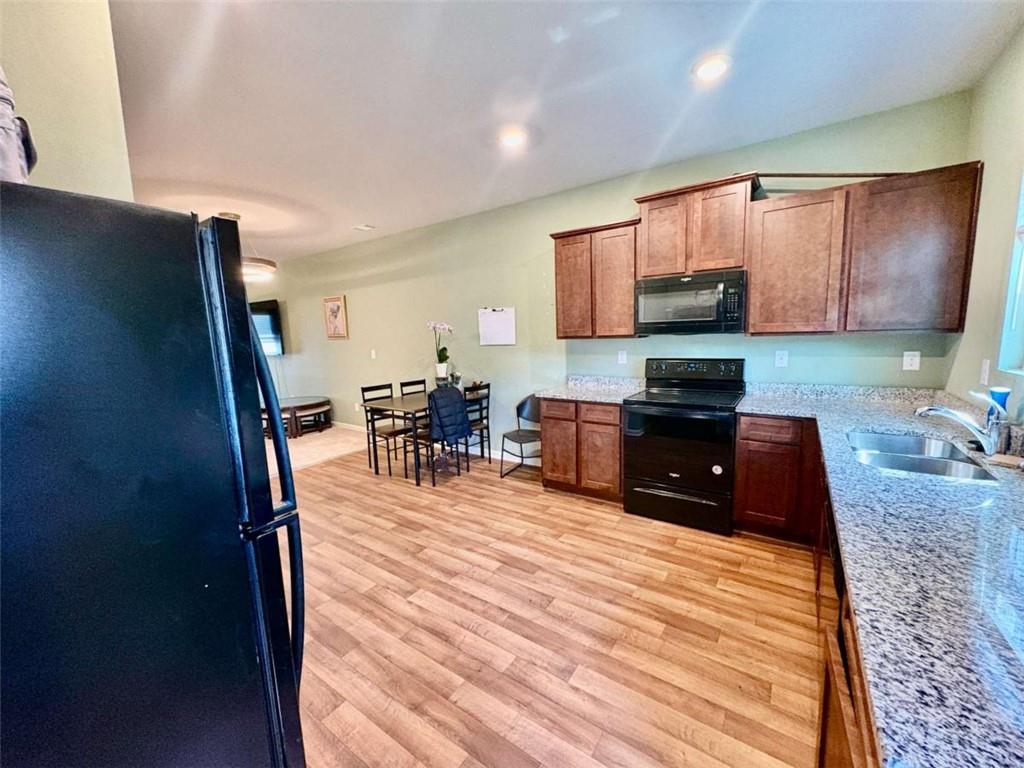 2176 Cypress Lane Southwest Atlanta, GA 30331 - Photo 6 of 17 a room with furniture and a flat screen tv