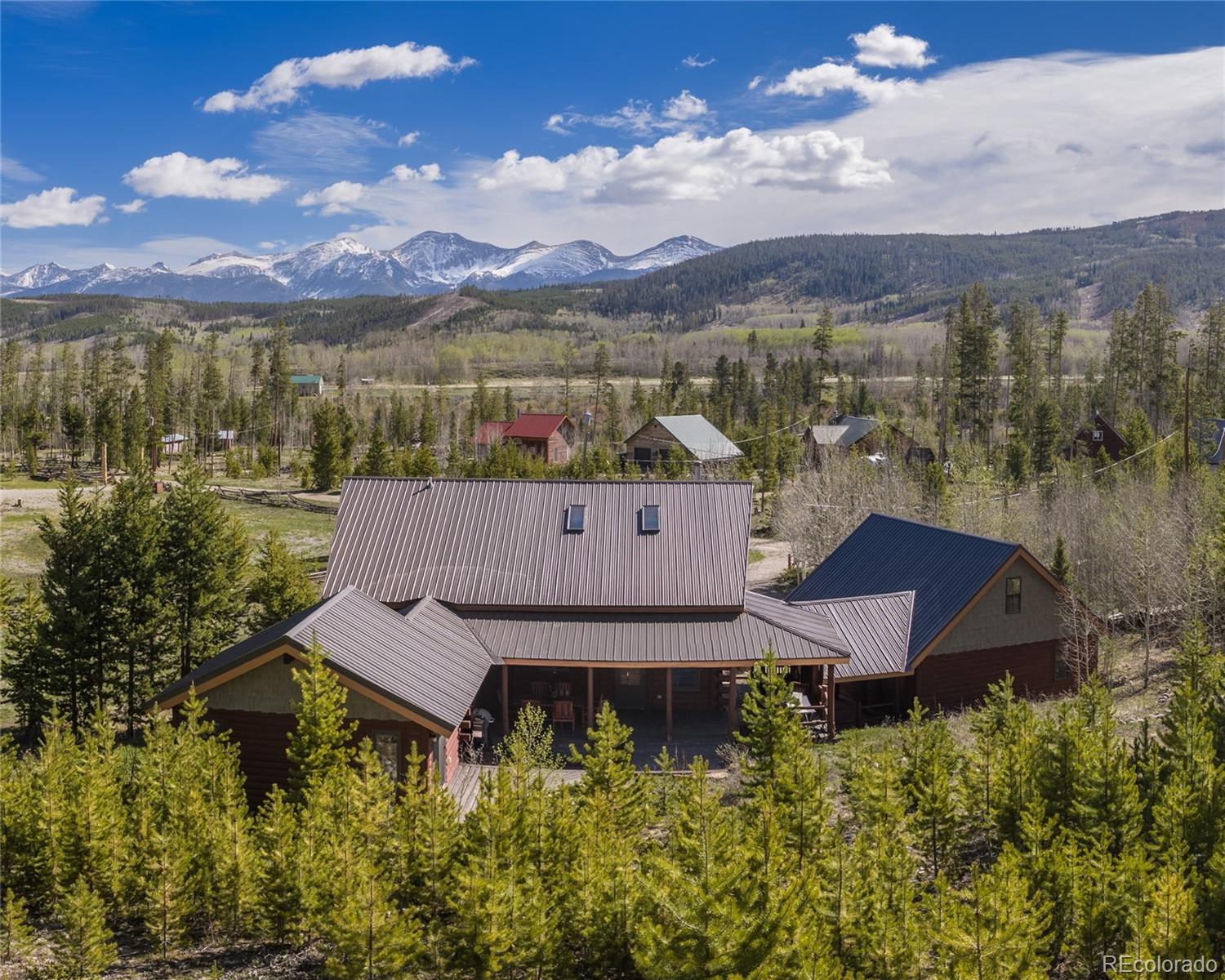 341 Anderson Road Walden, CO 80480 - Photo 48 of 50 a view of a house with a yard and a mountain view