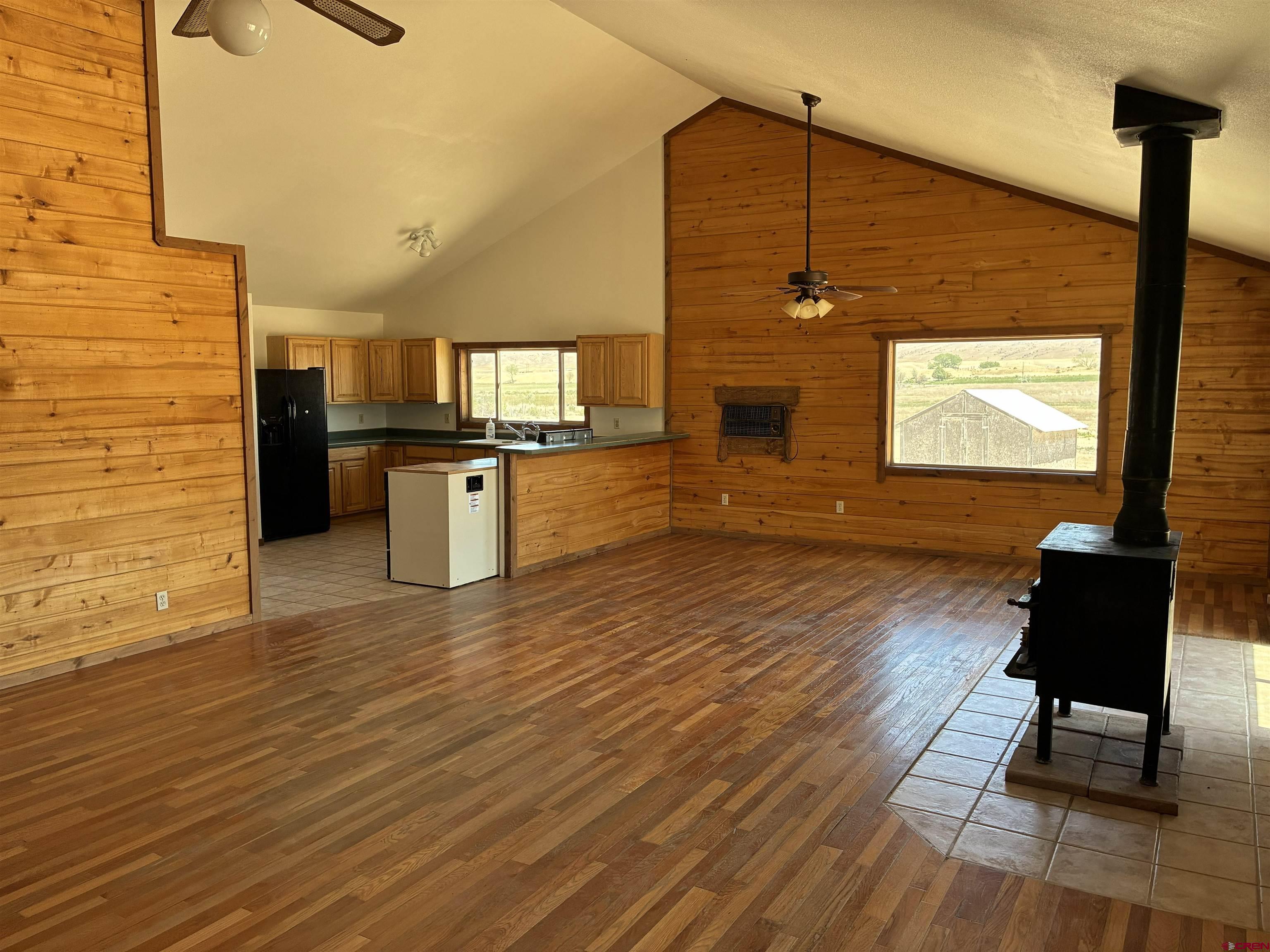 4491 2300th Road Delta, CO 81416 - Photo 4 of 25 a view of a living room with a flat screen tv