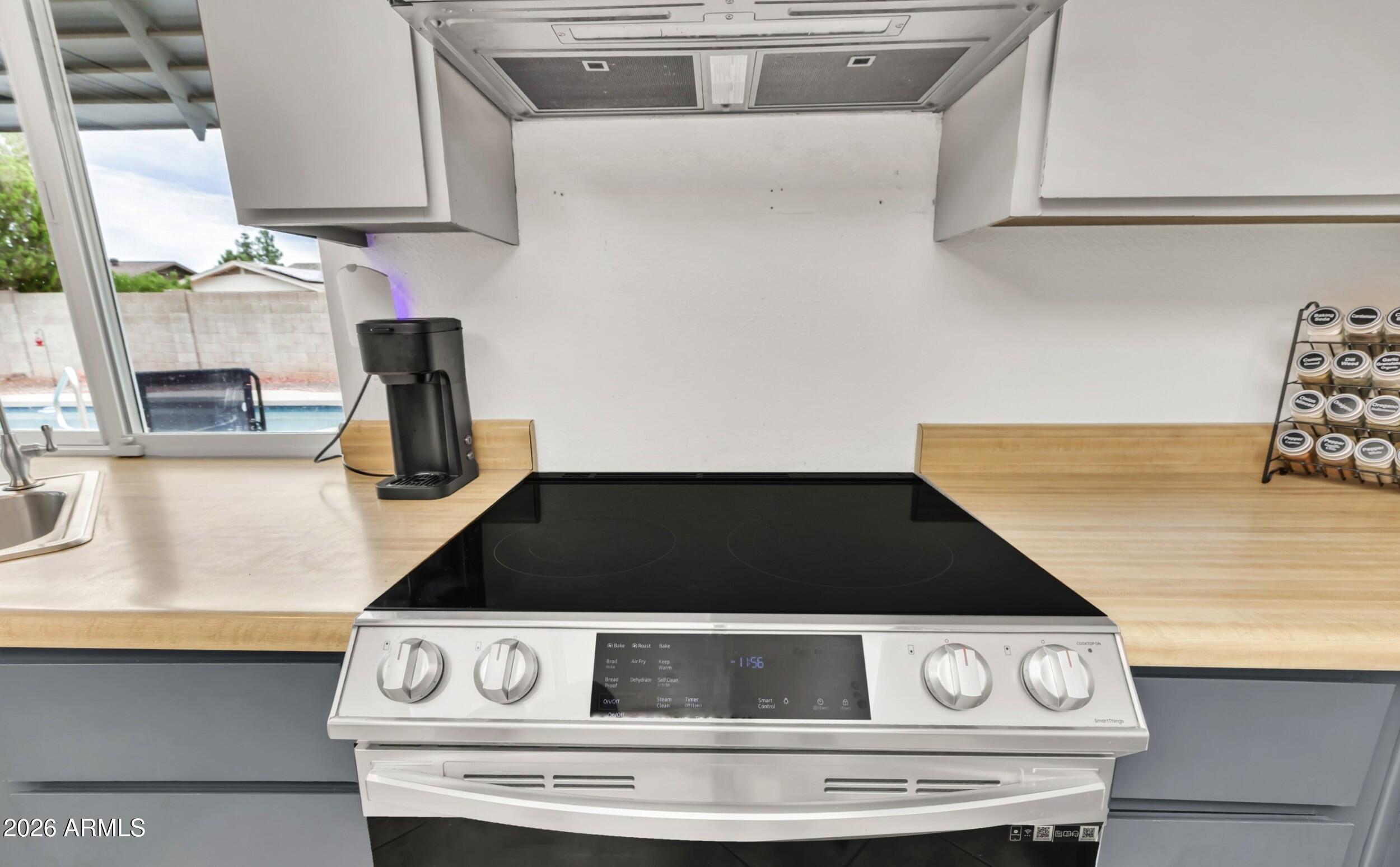 3833 West Phelps Road Phoenix, AZ 85053 - Photo 26 of 55 Range with convection/air fryer oven.