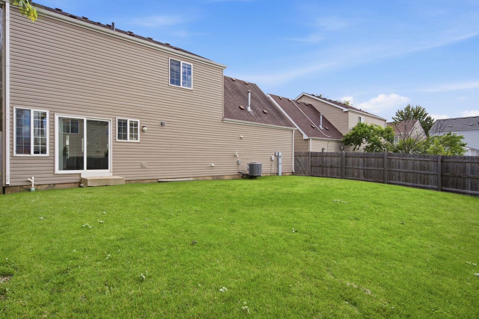 1758 Edith Lane Aurora, IL 60504 - Photo 24 of 28 a view of a house with backyard and garden
