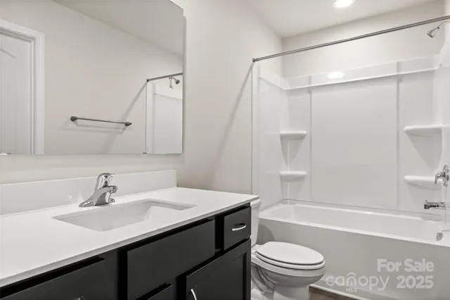 a bathroom with a sink a toilet and a bathtub