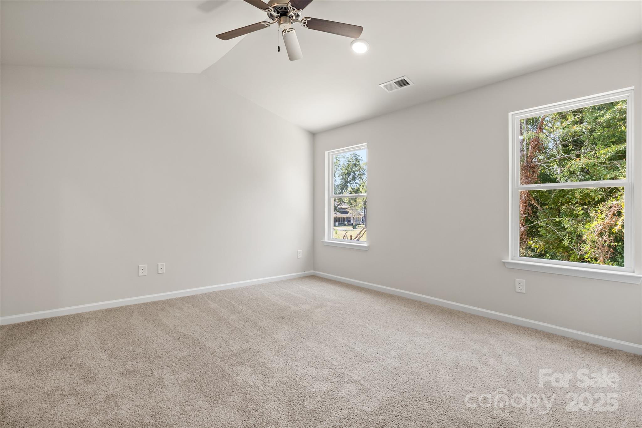 314 South French Street Lancaster, SC 29720 - Photo 14 of 39 an empty room with a window and a fan