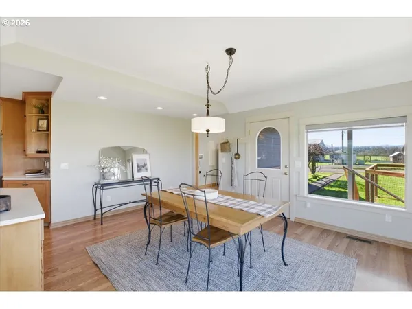 a living room with furniture a window and a chandelier
