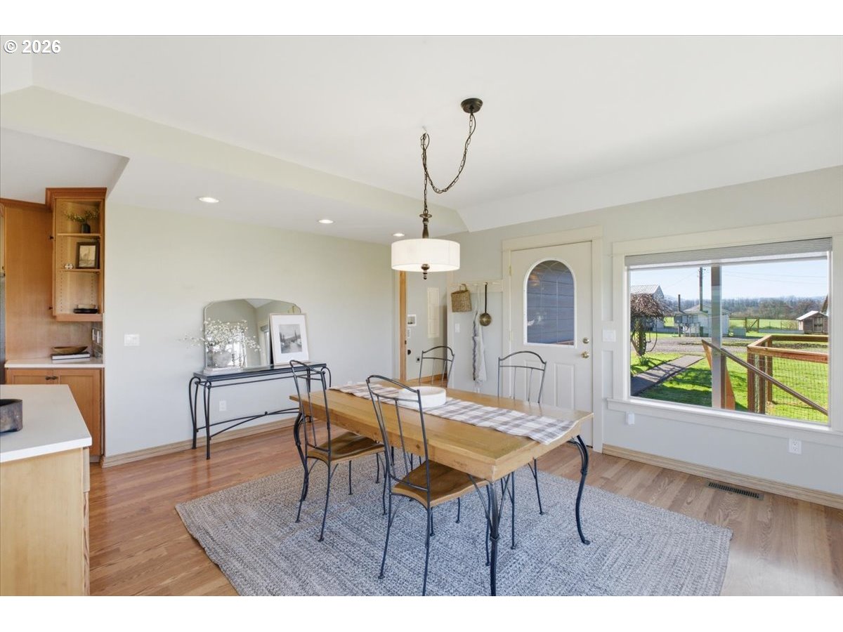 27144 Irish Bend Loop Halsey, OR 97348 - Photo 12 of 48 a living room with furniture a window and a chandelier