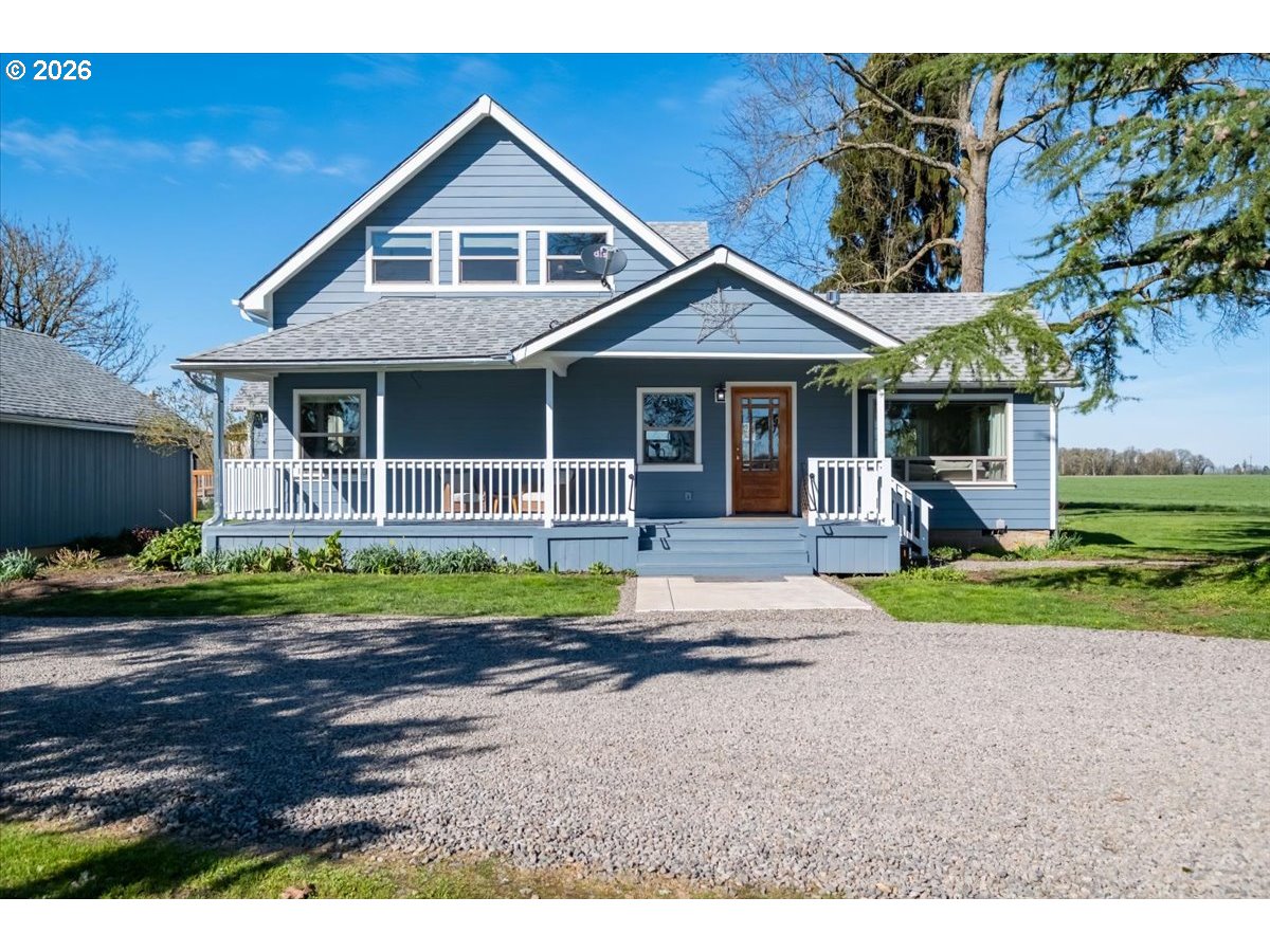 27144 Irish Bend Loop Halsey, OR 97348 - Photo 2 of 48 a front view of a house with a yard and potted plants