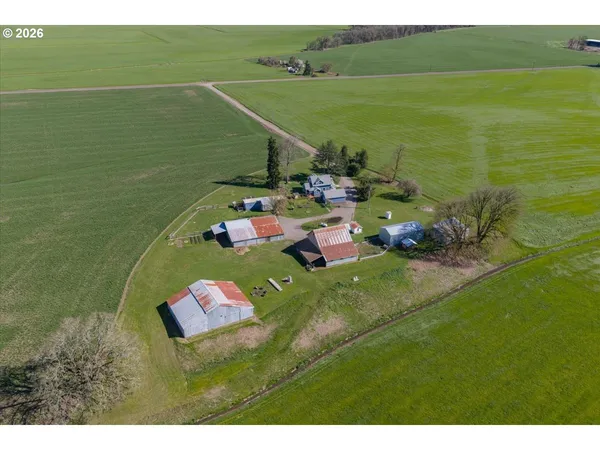 an aerial view of a house with outdoor space