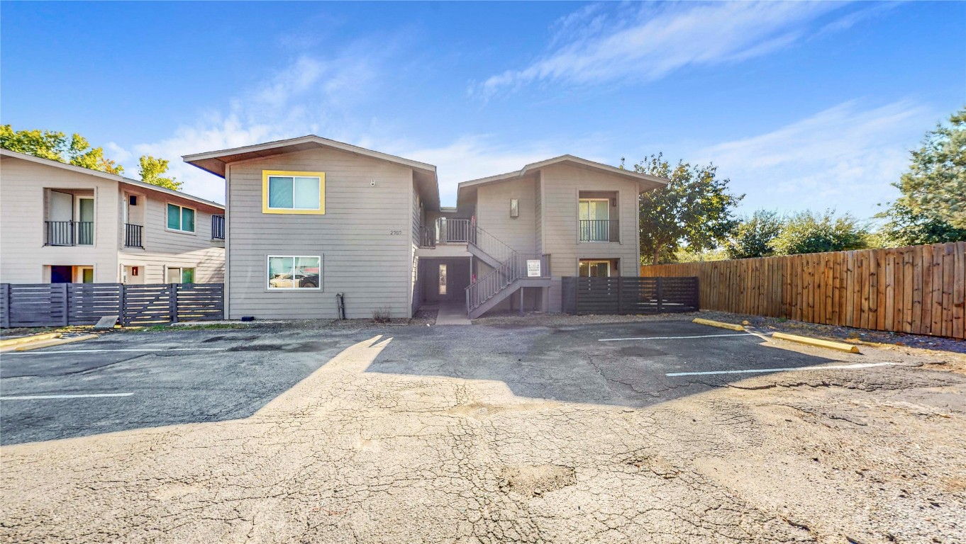 2707 Windswept Cove, Unit 102 Austin, TX 78745 - Photo 11 of 12 a view of a house with backyard and trees
