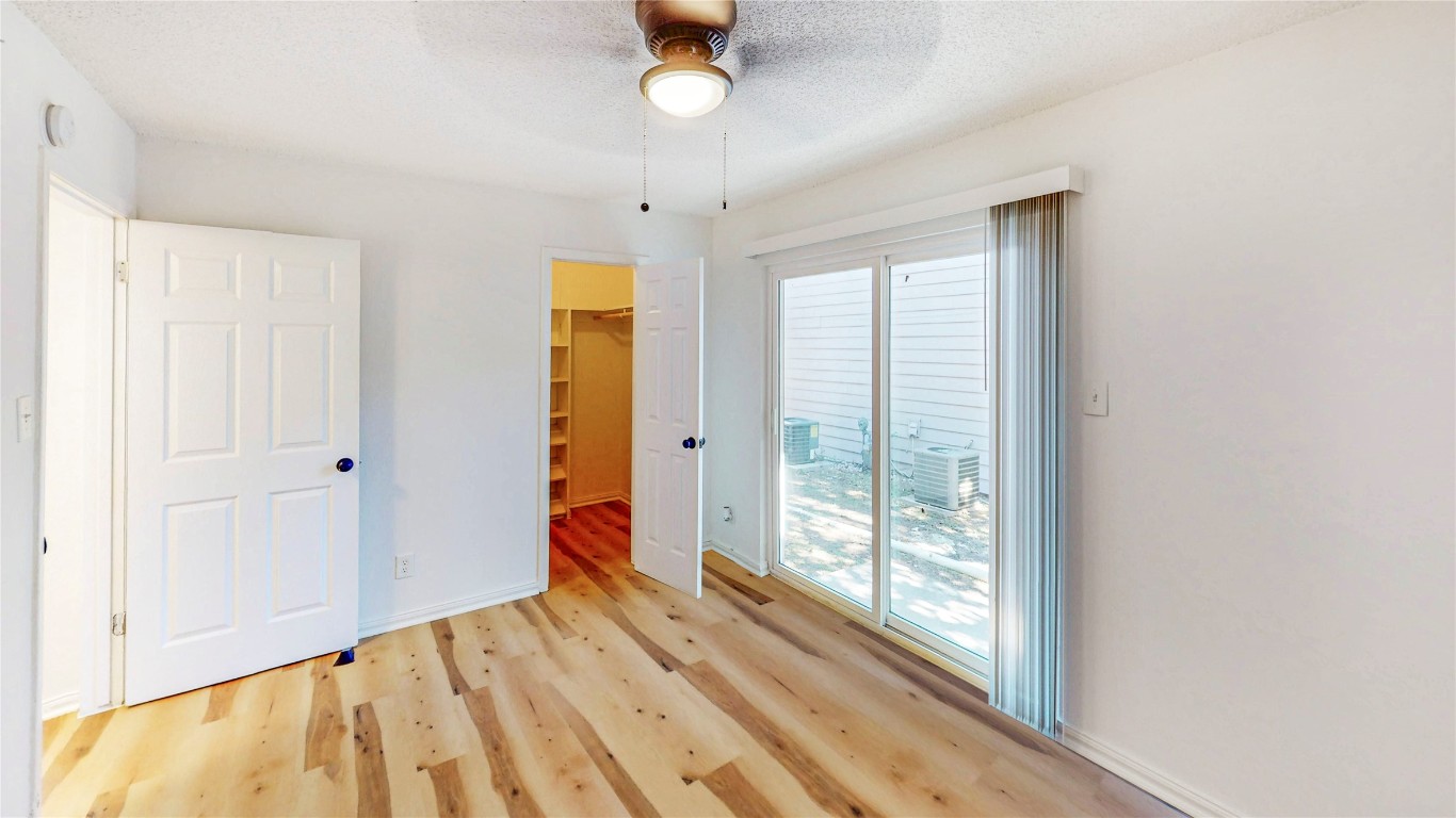 2707 Windswept Cove, Unit 102 Austin, TX 78745 - Photo 9 of 12 a view of an entryway with wooden floor and door