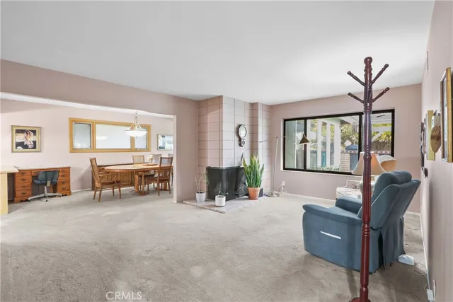 a living room with furniture and large windows