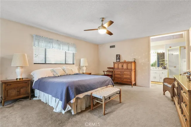 a bedroom with a bed and furniture