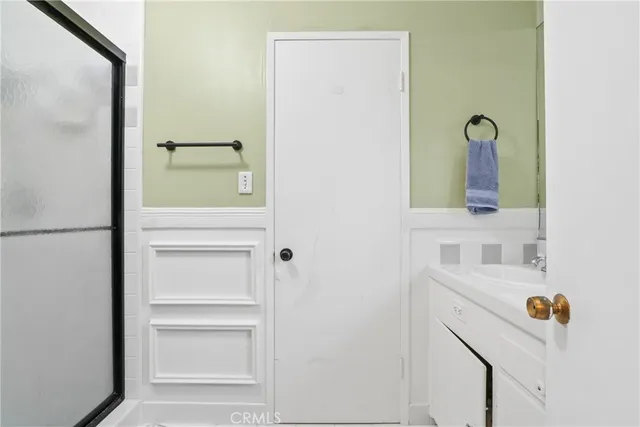 a bathroom with a sink and mirror