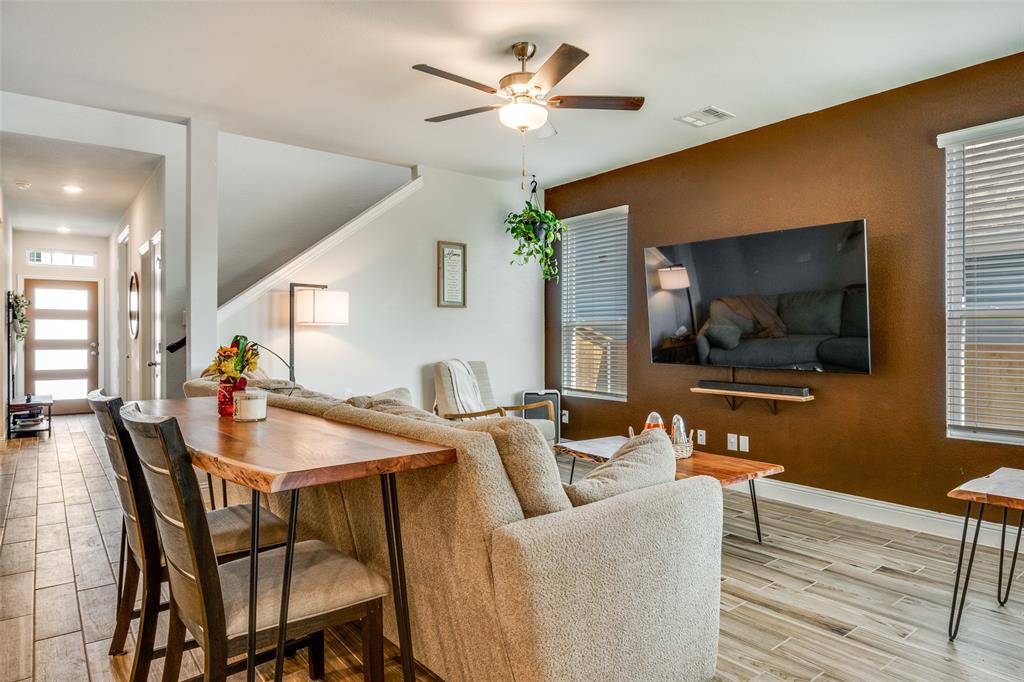 8413 Alba Lane Rowlett, TX 75089 - Photo 5 of 25 Living area with wood finish floors and a ceiling fan