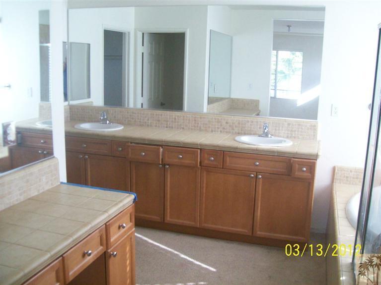 83401 Lone Star Road Indio, CA 92203 - Photo 6 of 10 a bathroom with a granite countertop sink and a mirror