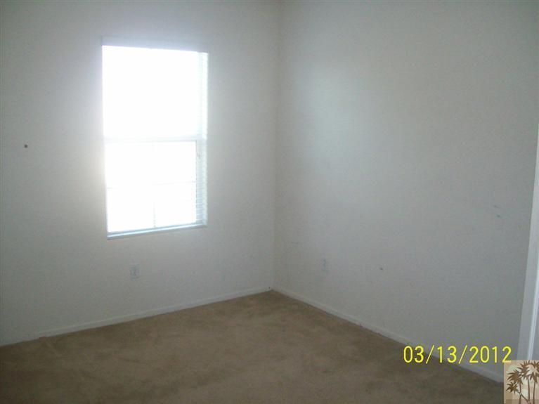 83401 Lone Star Road Indio, CA 92203 - Photo 8 of 10 an empty room with a window
