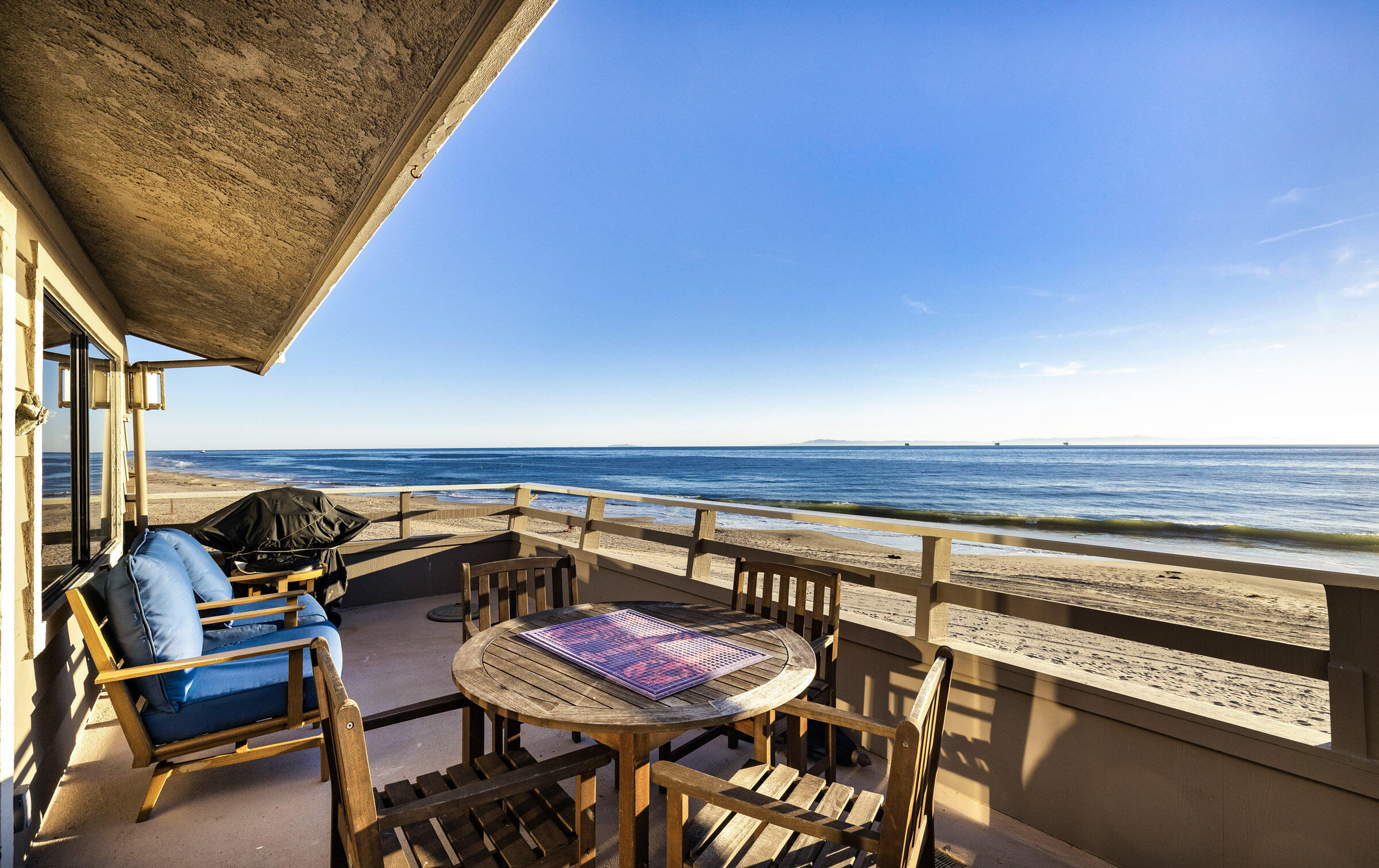 a patio with a table and chairs