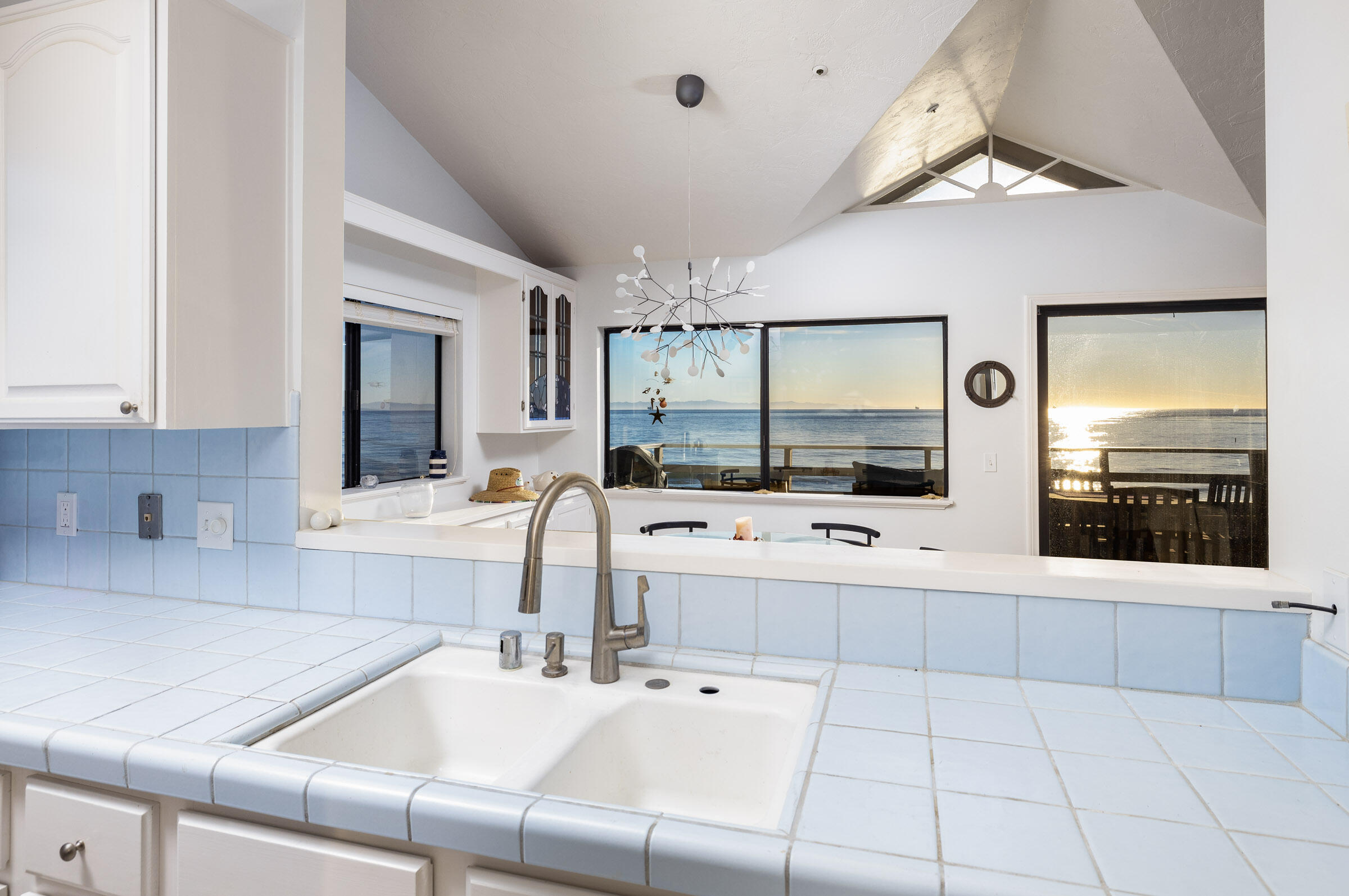 4925 Sandyland Road, Unit F Carpinteria, CA 93013 - Photo 14 of 19 a bathroom with a sink a large mirror and a shower