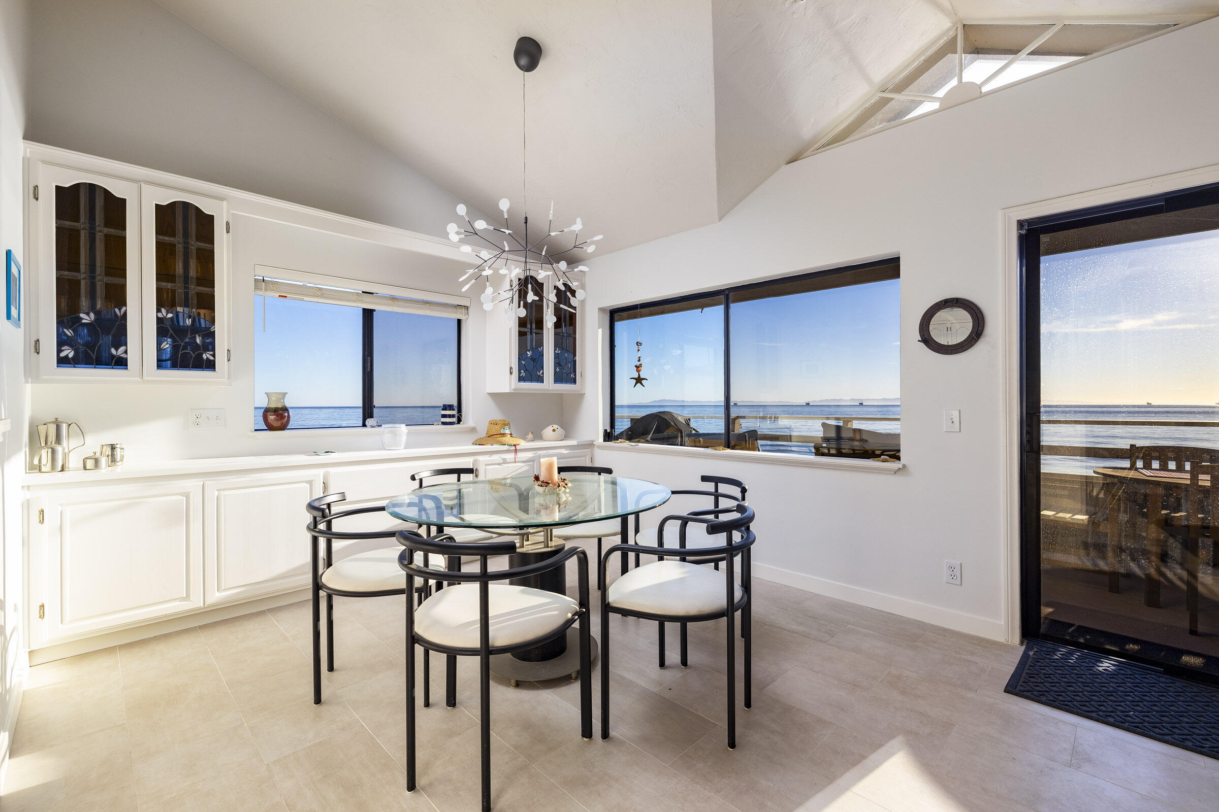 4925 Sandyland Road, Unit F Carpinteria, CA 93013 - Photo 16 of 19 a kitchen with a table and chairs in it