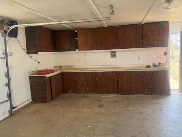 a kitchen with a sink and cabinets