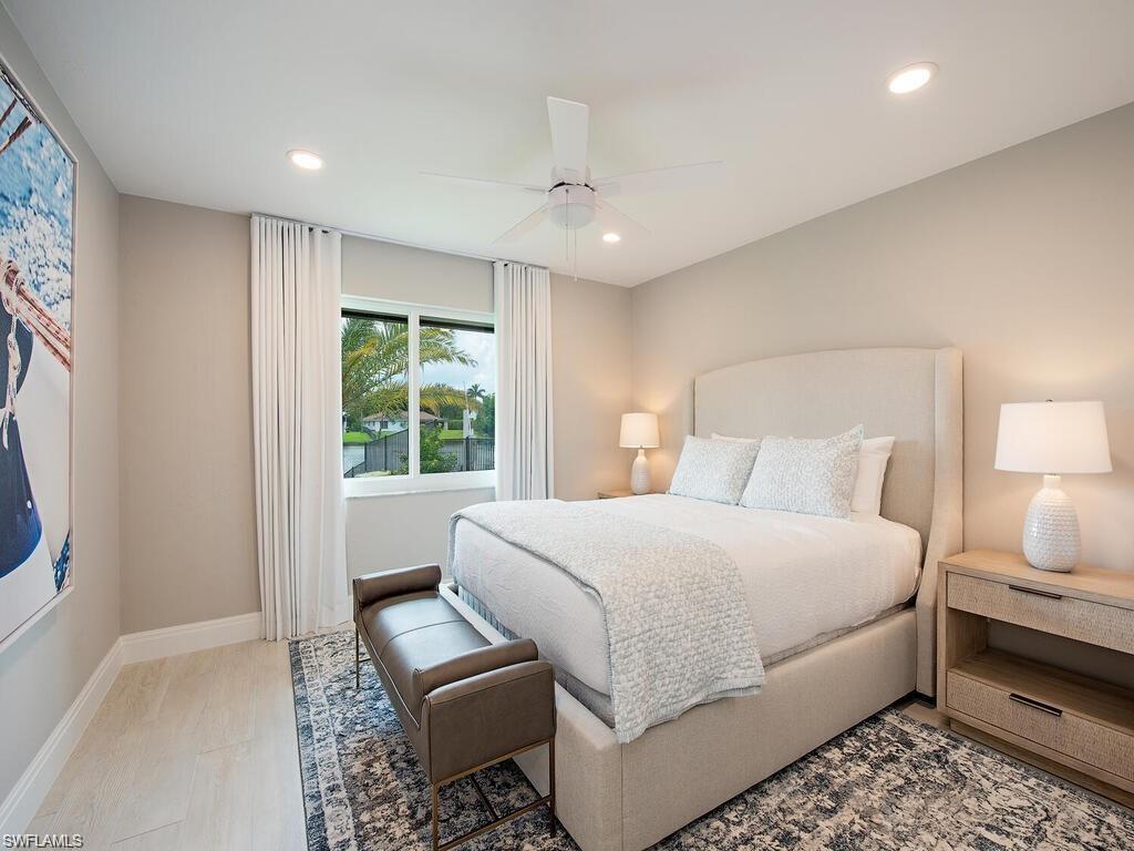4856 Crayton Road Naples, FL 34103 - Photo 18 of 24 a bedroom with a bed and a window